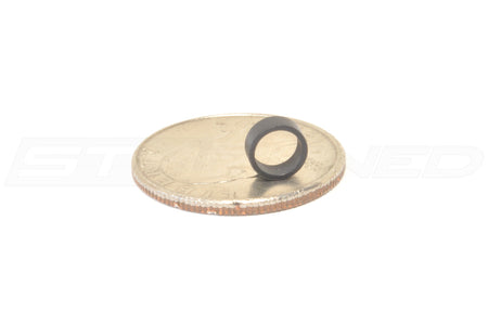 Toyota OEM Fuel Injector Insulator for Supra GR (23291WAA02) Pictured with a quarter for reference