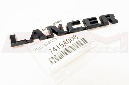 Mitsubishi OEM Evo 9 JDM Black Lancer Badge (7415A008) Image © STM Tuned Inc