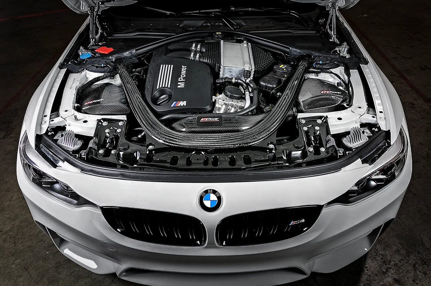 aFe Black Series Momentum Carbon Cold Air Intake for F8X BMW M2 Competition, M3, and M4 with S55 engine installed on M4