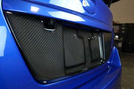 APR Carbon Fiber License Plate Frame for 2015-2021 WRX/ STi (CBX-WRXLIC15) installed upclose view
