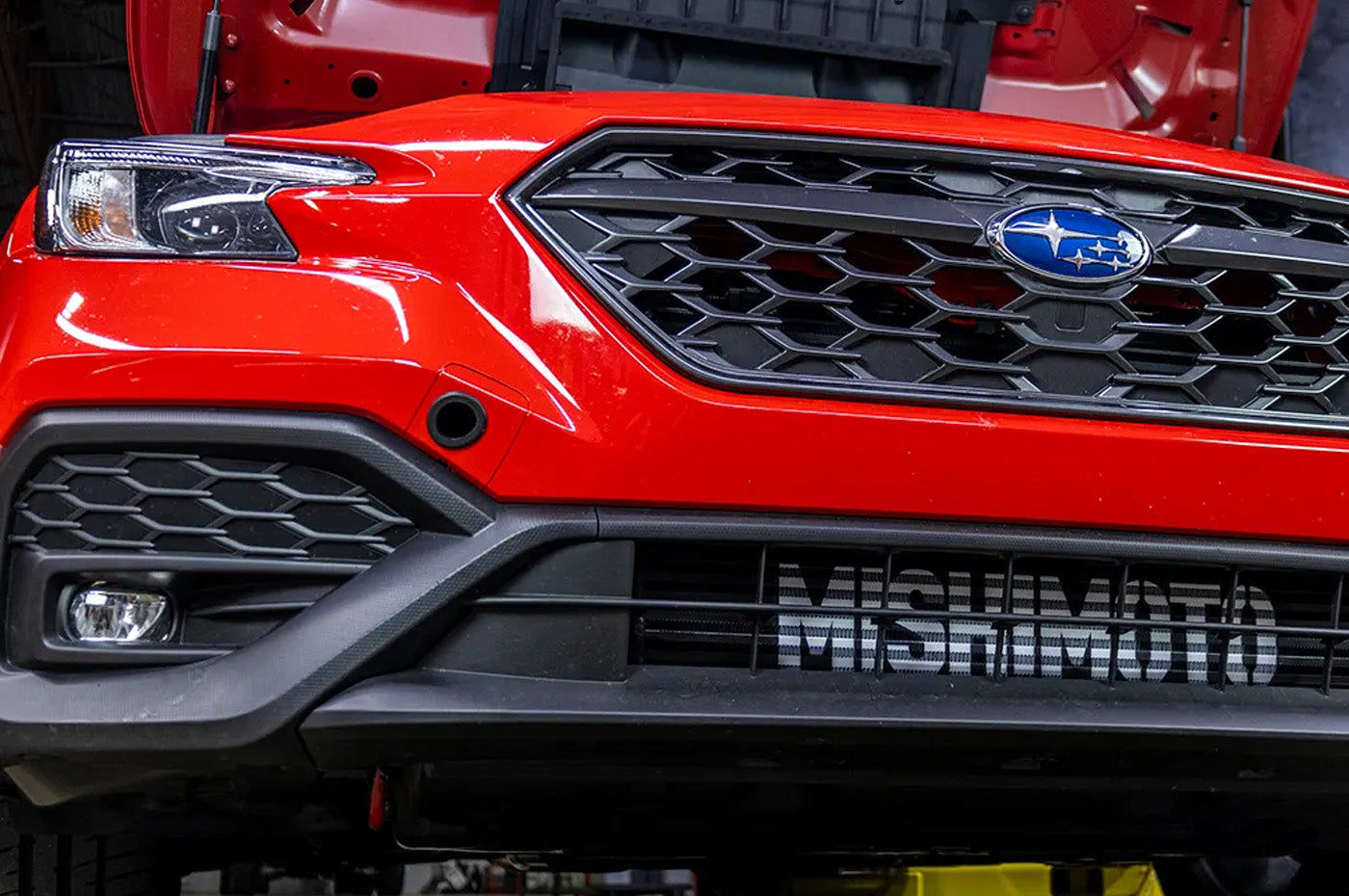 Mishimoto Performance FMIC & Intake Kit for 2022+ WRX (MMINT-WRX-22AIBKRD) black front mount intercooler with red piping installed on VB WRX