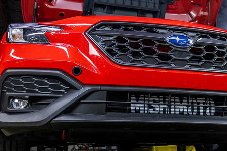 Mishimoto Performance FMIC & Intake Kit for 2022+ WRX (MMINT-WRX-22AIBKRD) black front mount intercooler with red piping installed on VB WRX