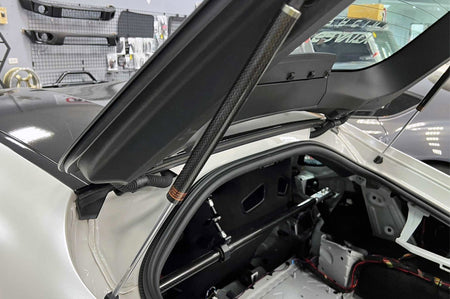 Rexpeed Carbon Fiber Rear Trunk Gas Strut Dampers for 2020+ Supra installed