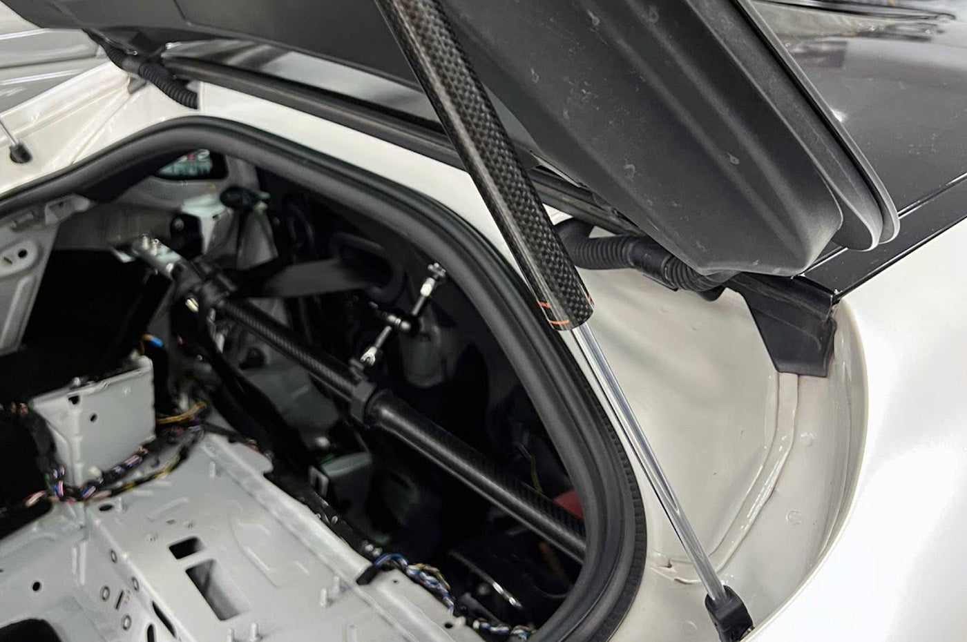 Rexpeed Carbon Fiber Rear Trunk Gas Strut Dampers for 2020+ Supra installed