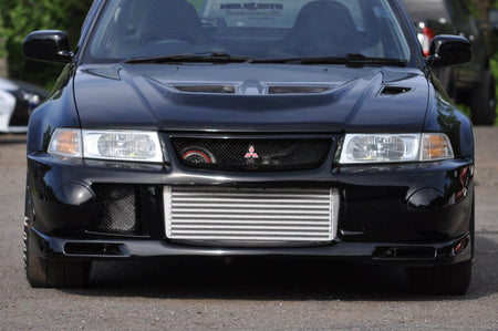 Forward Facing Turbo Exhaust Manifold installed on a black Evo 5
