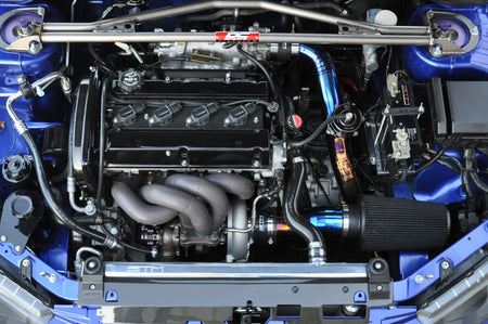 Evo 7 8 9 Stock Replacement Exhaust Manifold installed with black ceramic coating