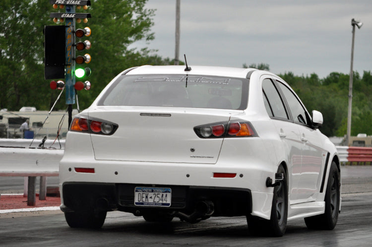 Evo X with drag wheels and slicks at the track