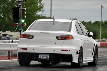 Evo X with drag wheels and slicks at the track